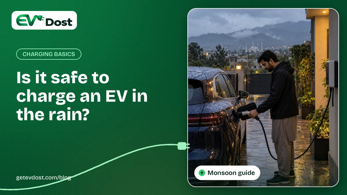 A man plugs in his car at a wall charger on a rainy evening with wet ground and hills behind him